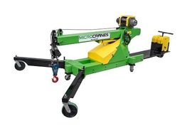 Stablizing Outrigger Legts Green and yellow mobile machine tool with black wheels and a hook attachment on a white background