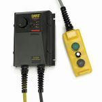 Black control box with a yellow handheld three-button remote attached by coiled cords