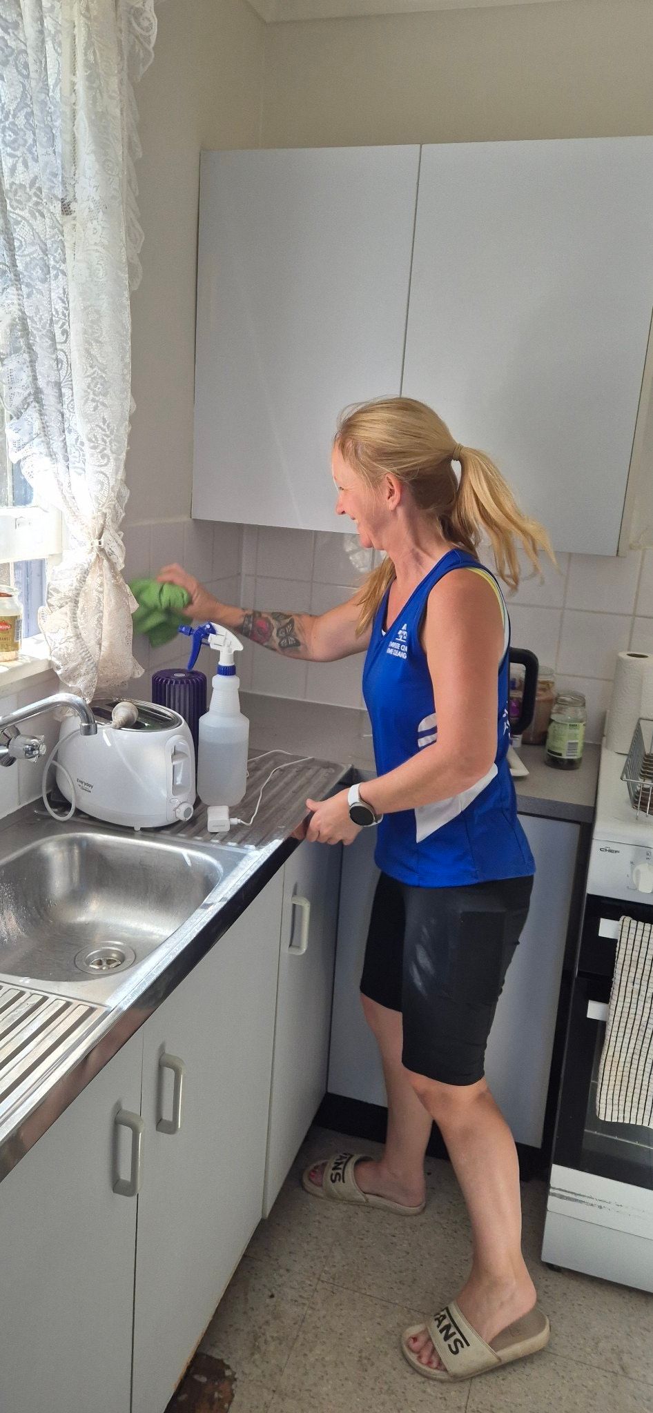 A Person Is Using a Machine to Clean a Floor — Complete Clean Home Cleaning in Primbee, NSW