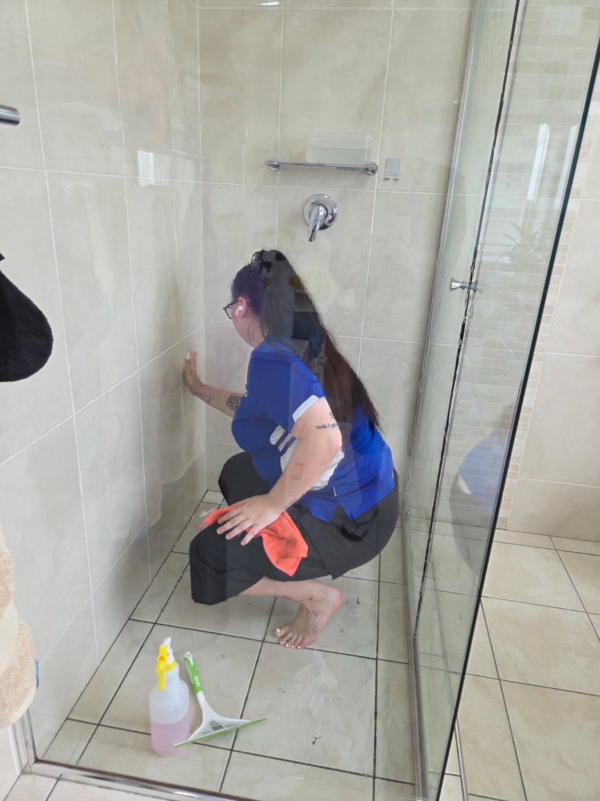 A Group of Cleaners Are Standing Next to Each Other — Complete Clean Home Cleaning in Primbee, NSW