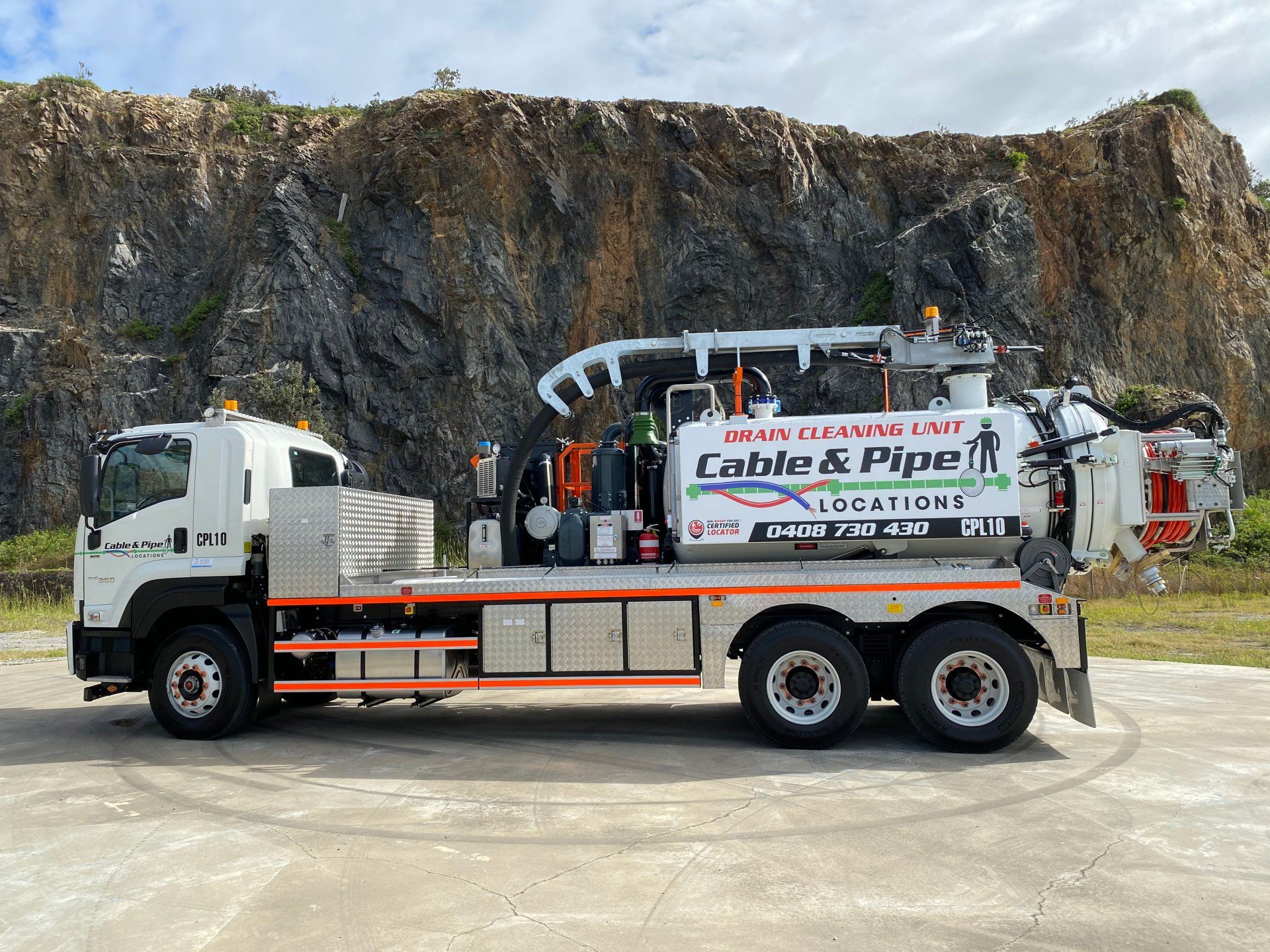 A Cable and Pipe Truck Is Parked in Front of A Mountain — Cable & Pipe Locations in Taree, NSW