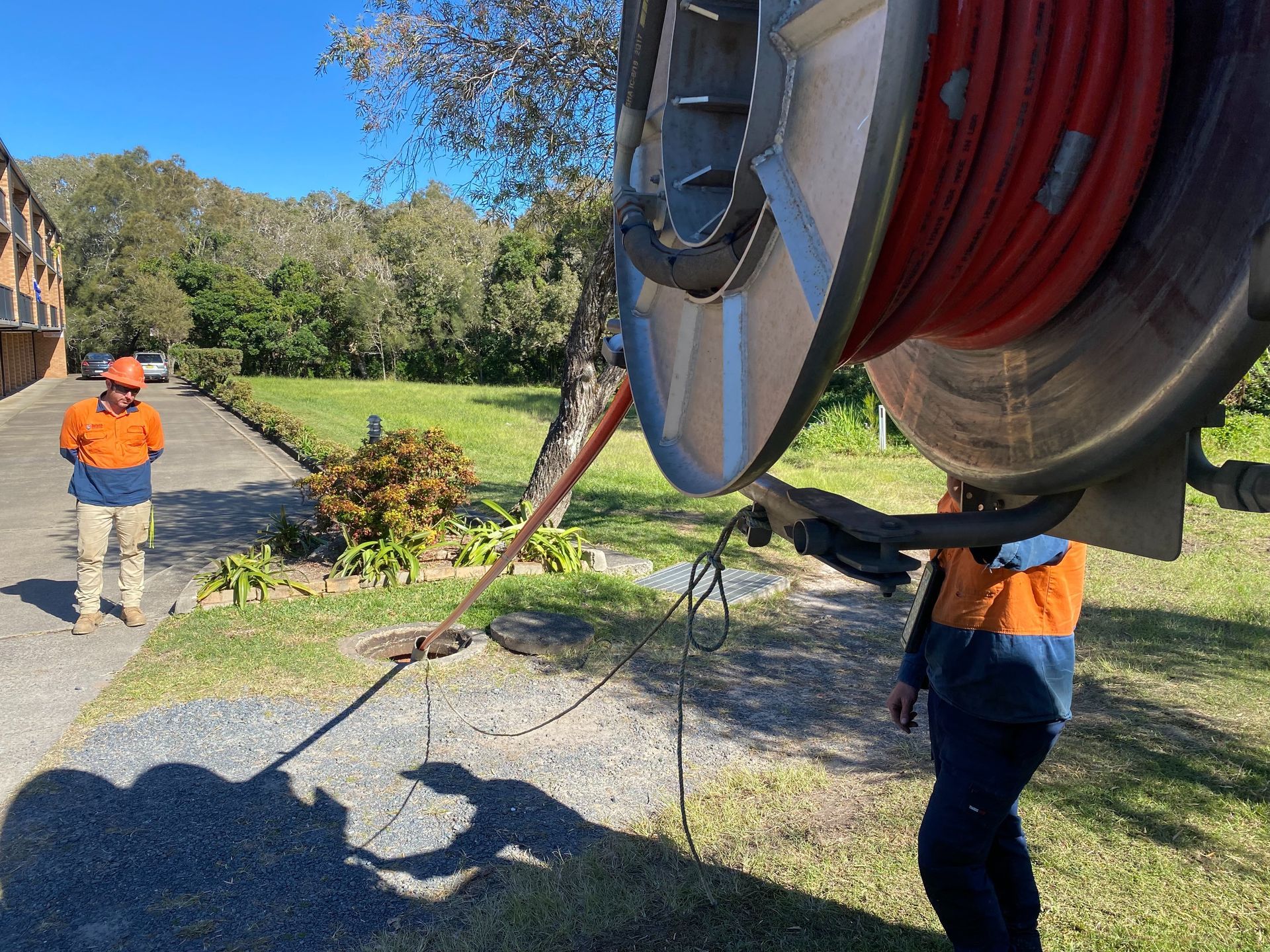 Two Workers Utility Surveying Before Working