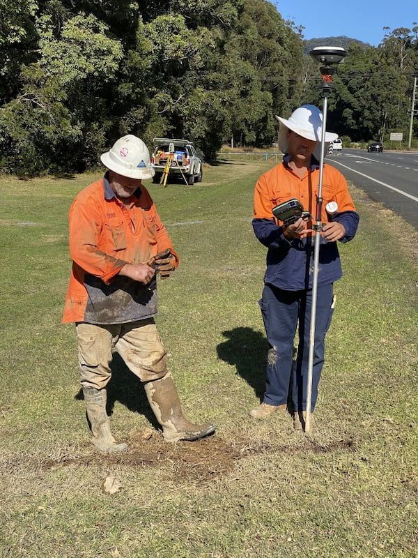 Two Workers Using Underground Detector — Cable & Pipe Locations in Woolgoolga, NSW