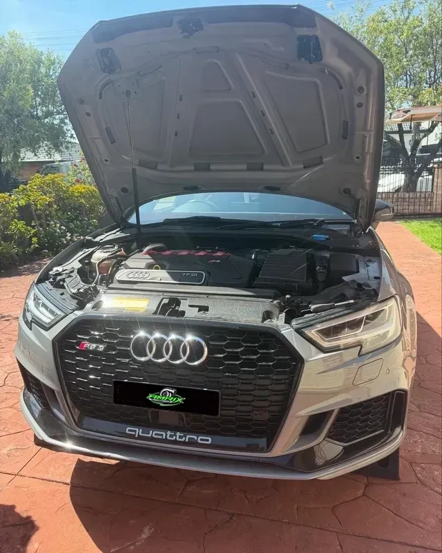 Gray Audi RS3 with hood open, parked outdoors on a sunny day — Amrix Automotive In Bankstown, NSW