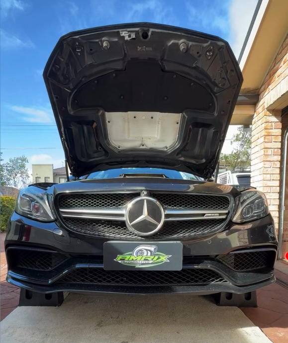 Black Mercedes With Hood Open, Parked on Ramps. Sunlight, Clear Sky — Amrix Automotive In Parramatta, NSW