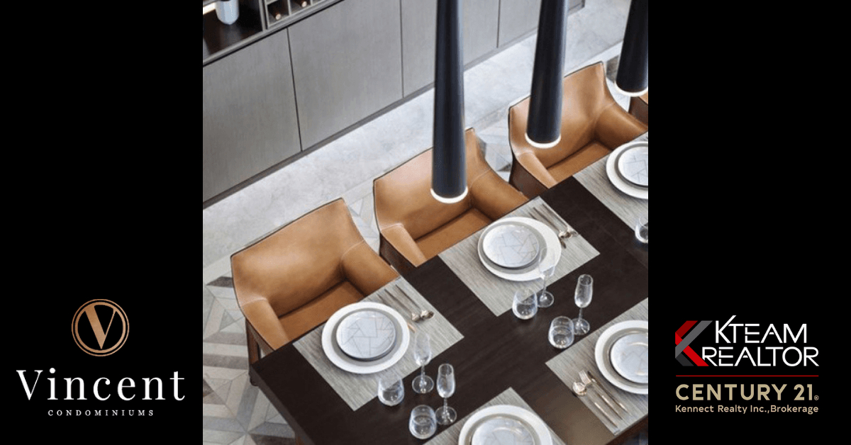 An aerial view of a dining room table with plates and chairs.