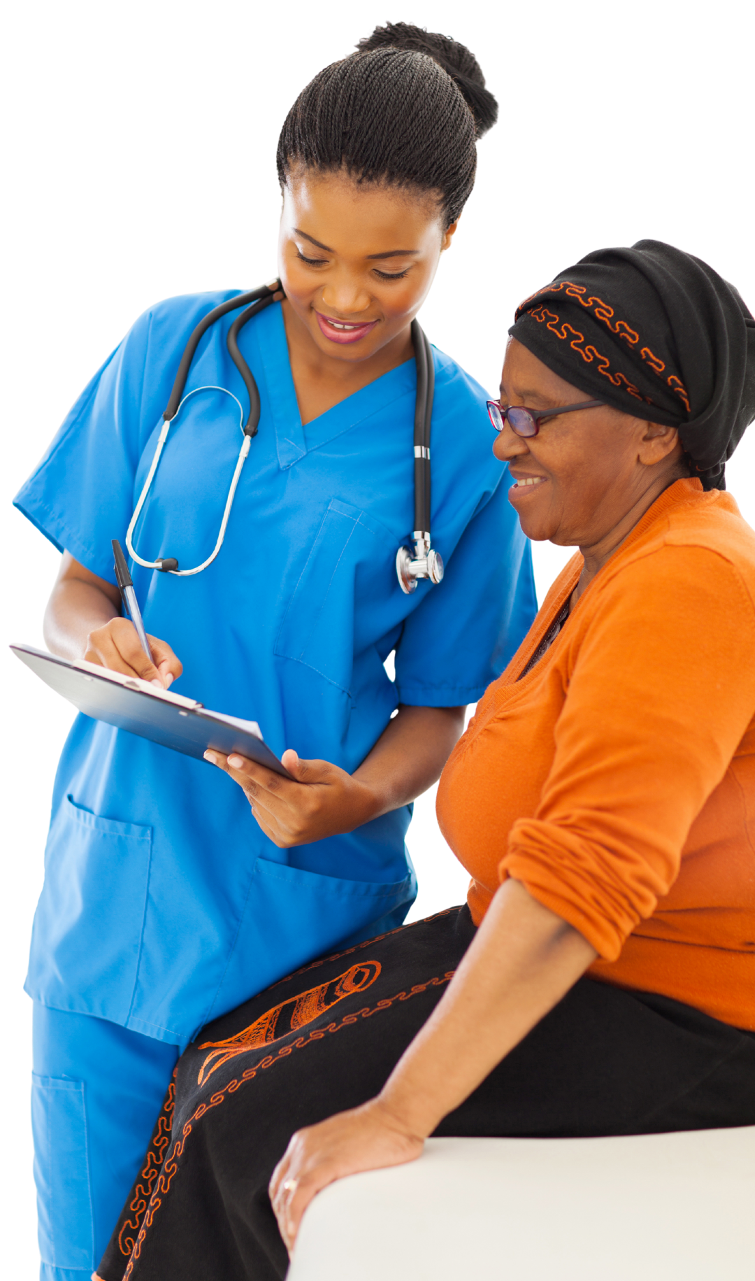 Nurse in blue scrubs taking notes while talking to a smiling elderly woman in orange, indoors.