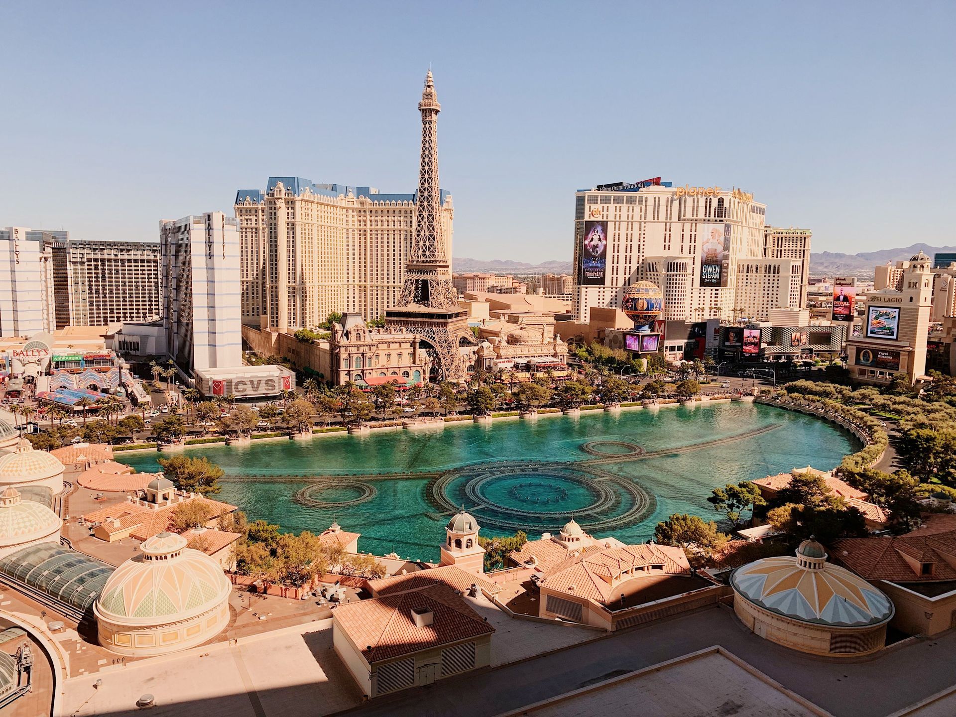 Las Vegas Strip skyline with the Bellagio fountains and turquoise lake at sunset