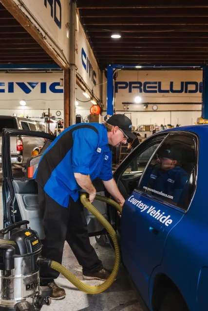 Our Mechanic Cleans a Vehicle in Rohnert Park, CA | Automotive Excellence