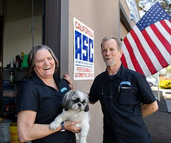 The Owners of Automotive Excellence with a dog in Rehnert Park, CA