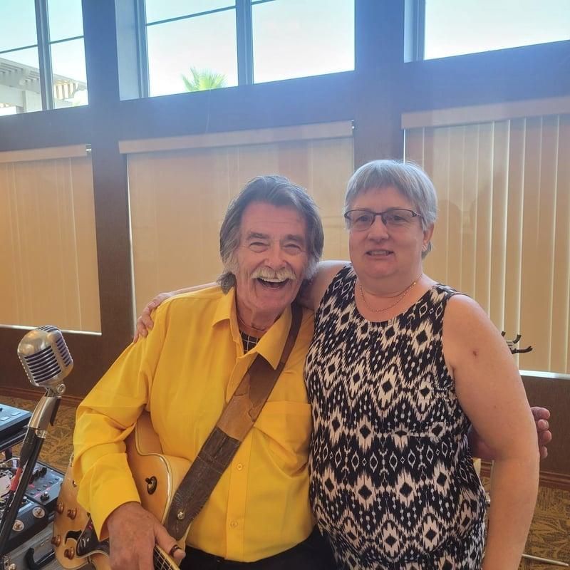 Two people smiling indoors