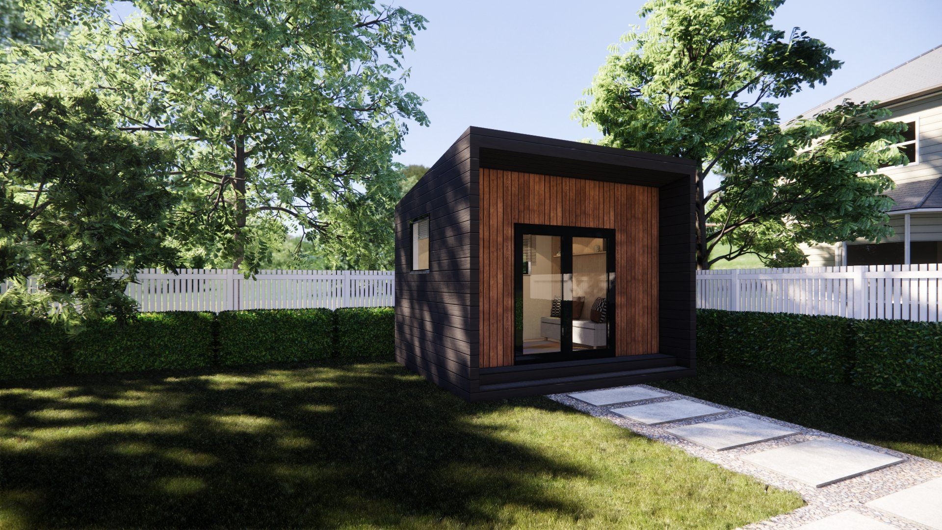 A small house is sitting in the middle of a lush green yard.