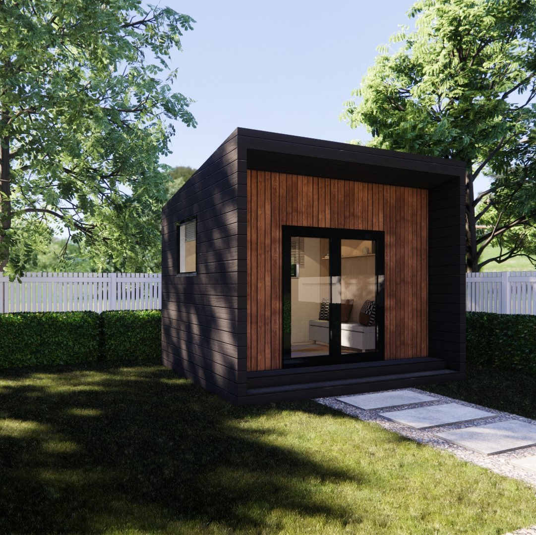 A small house is sitting in the middle of a lush green yard.