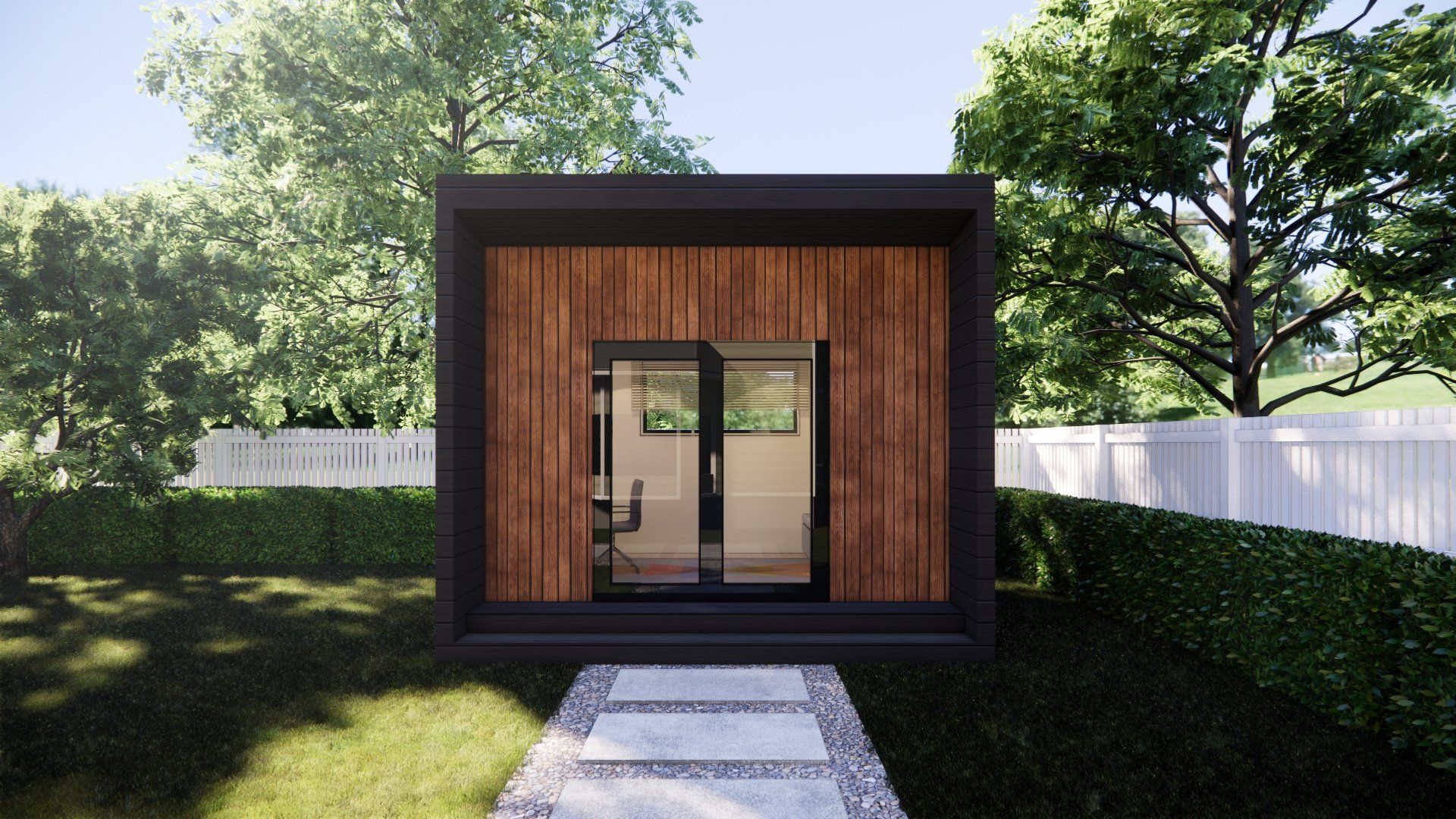 A small house is sitting in the middle of a yard surrounded by trees.
