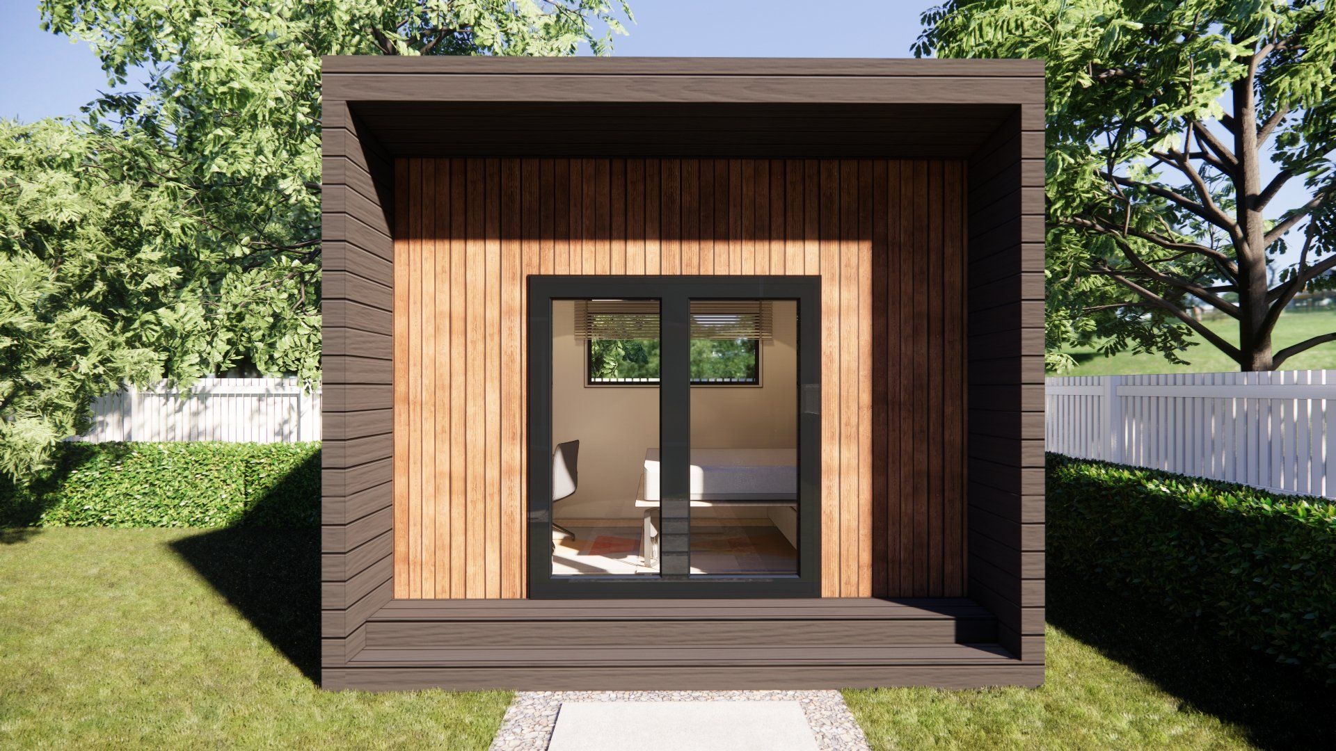A small wooden house with sliding glass doors is sitting in the middle of a grassy yard.