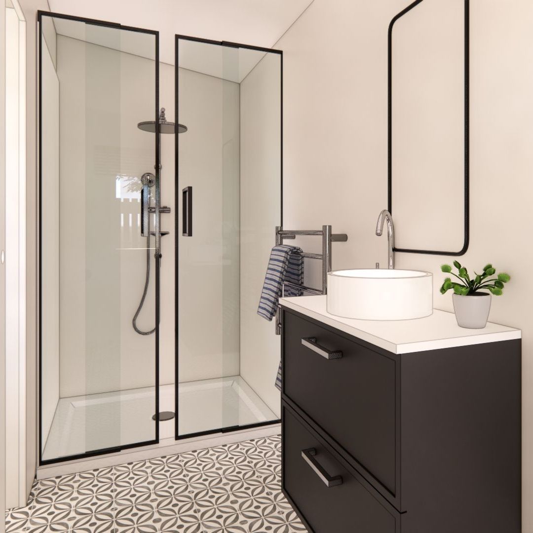 A bathroom with a sink and a walk in shower
