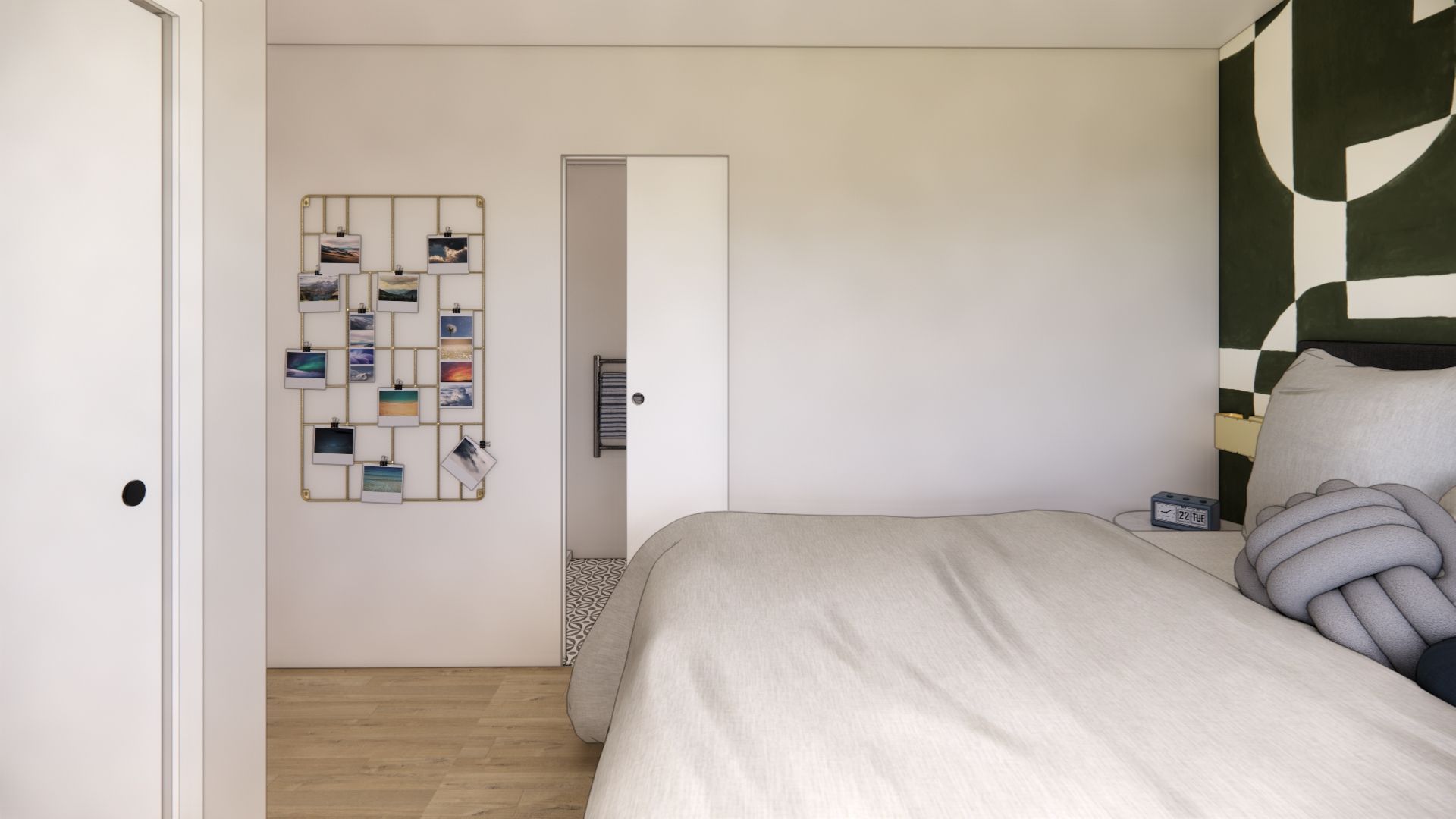 A bedroom with a bed , closet , and a wall with a picture on it.