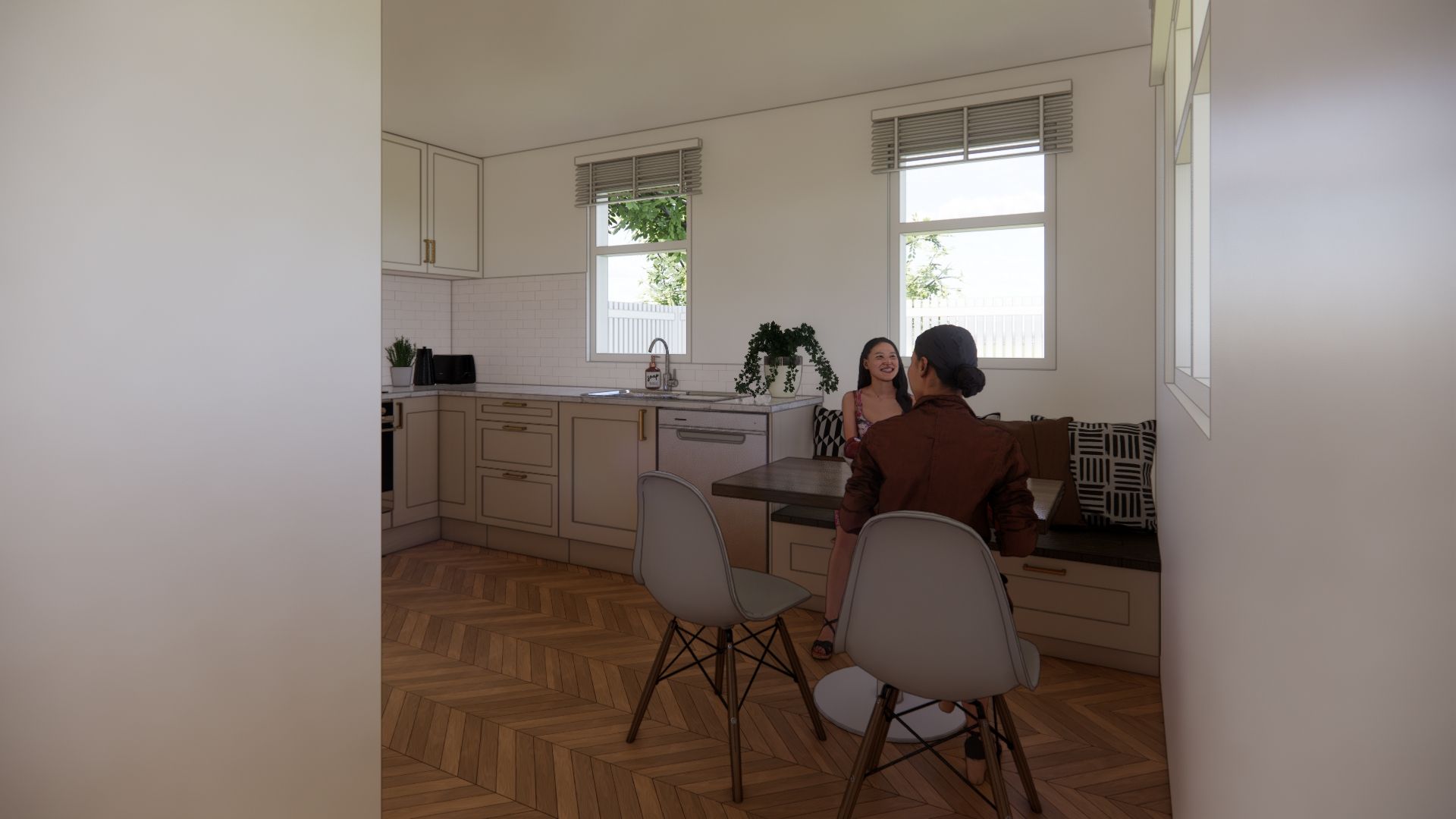 A couple of people are sitting at a table in a kitchen.