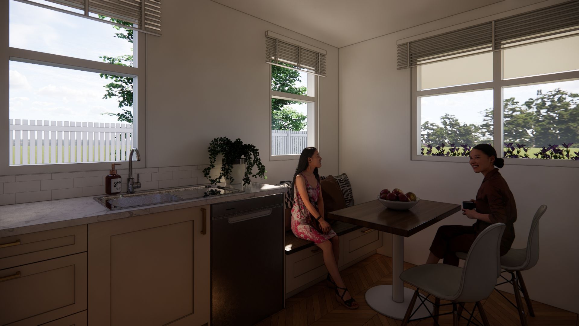Two women are sitting at a table in a kitchen.