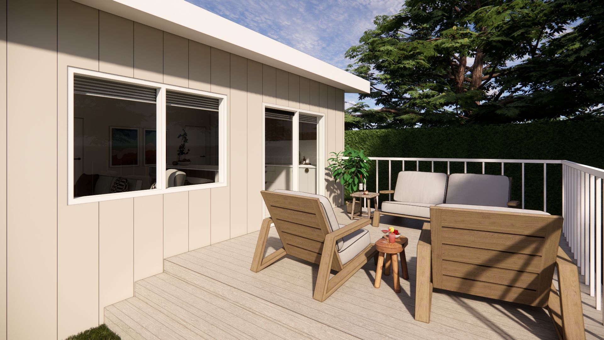 A deck with chairs and a table in front of a house.