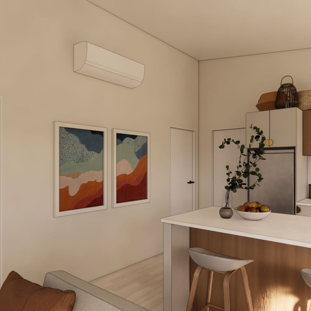 A living room with a couch , table , stools and two paintings on the wall.