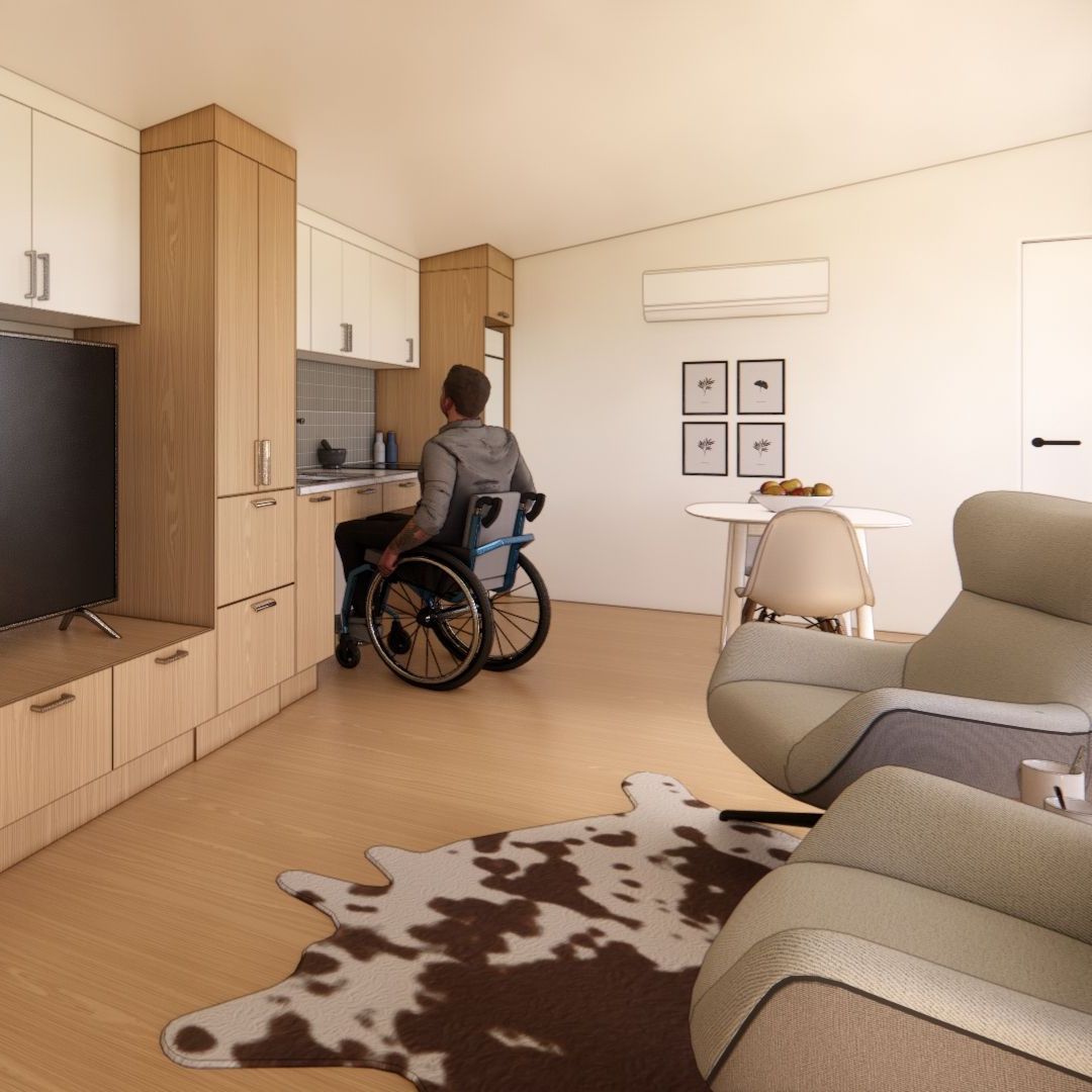 A man in a wheelchair is sitting in a living room