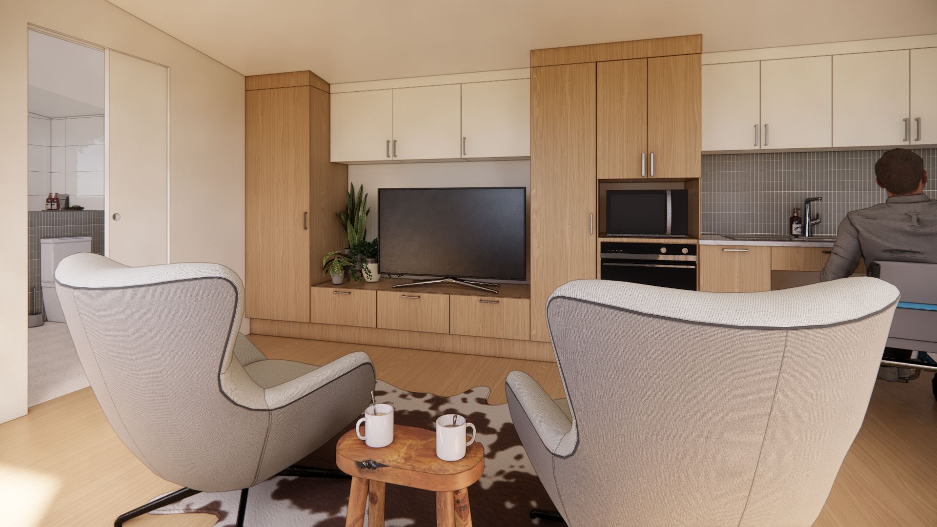 A living room with two chairs and a television.