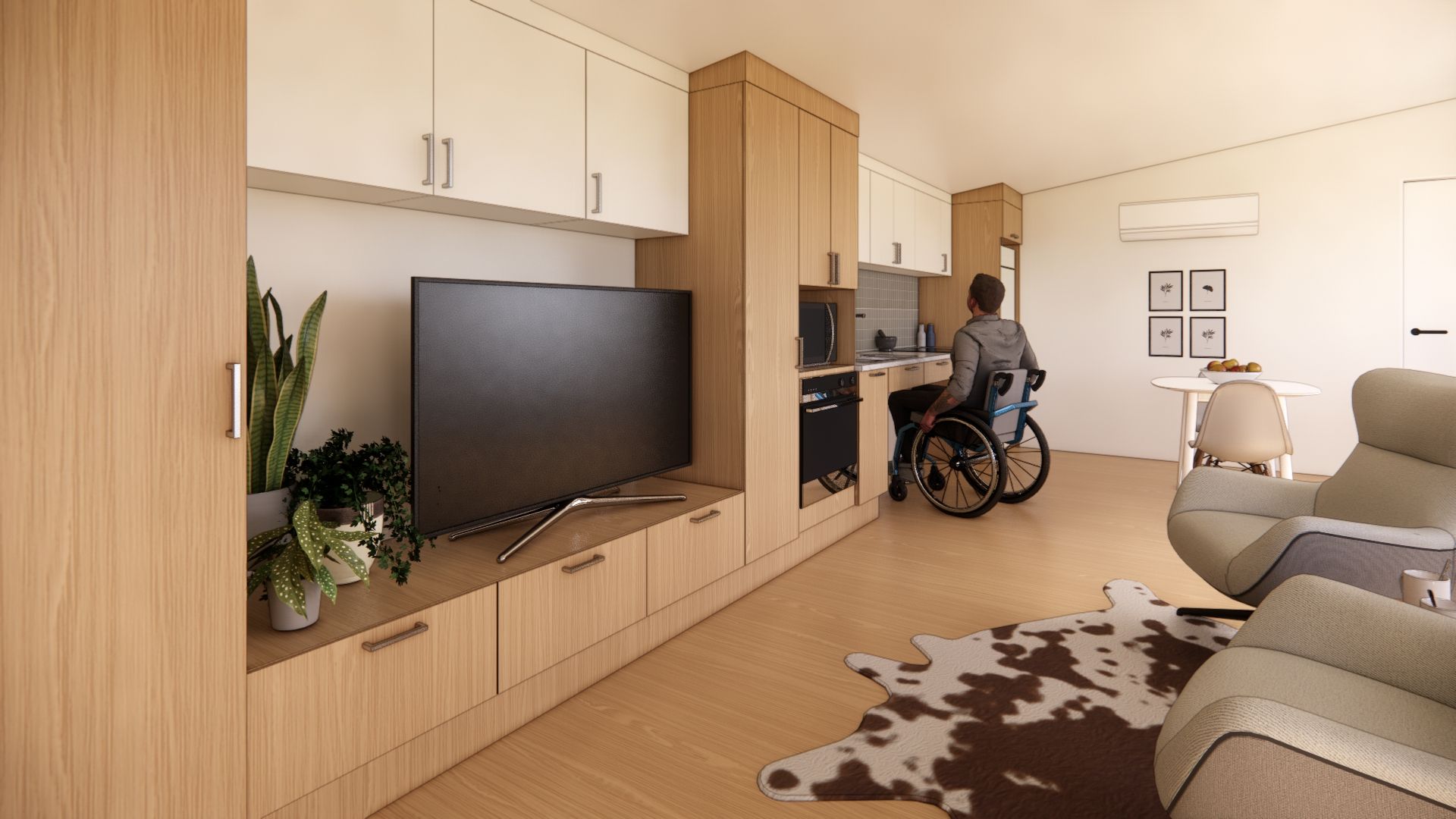A man in a wheelchair is sitting in a living room with a flat screen tv.
