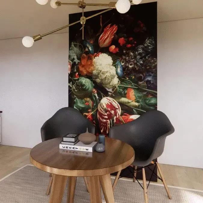 A living room with a table and chairs and a painting on the wall