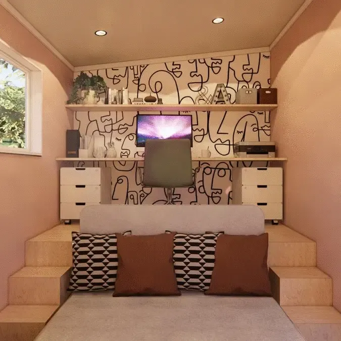 A bedroom with a bed and a television on the wall