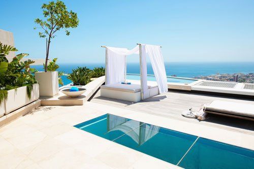 Lounge with a swimming pool and bed — Yorkville, IL — Travel Services of Yorkville