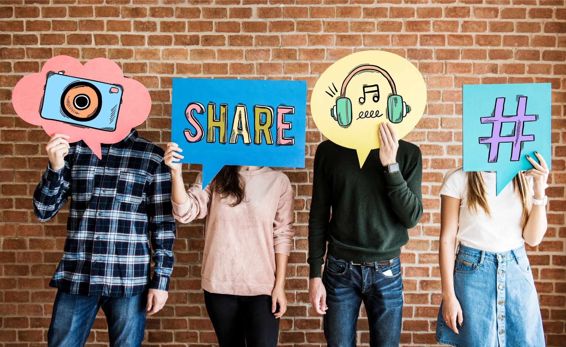 Four people holding speech bubbles with a camera, 
