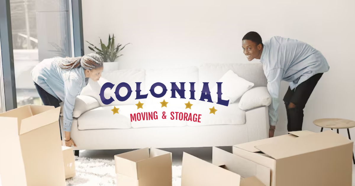 Two movers carrying a sofa in a bright room with boxes; Colonial Moving & Storage logo centered