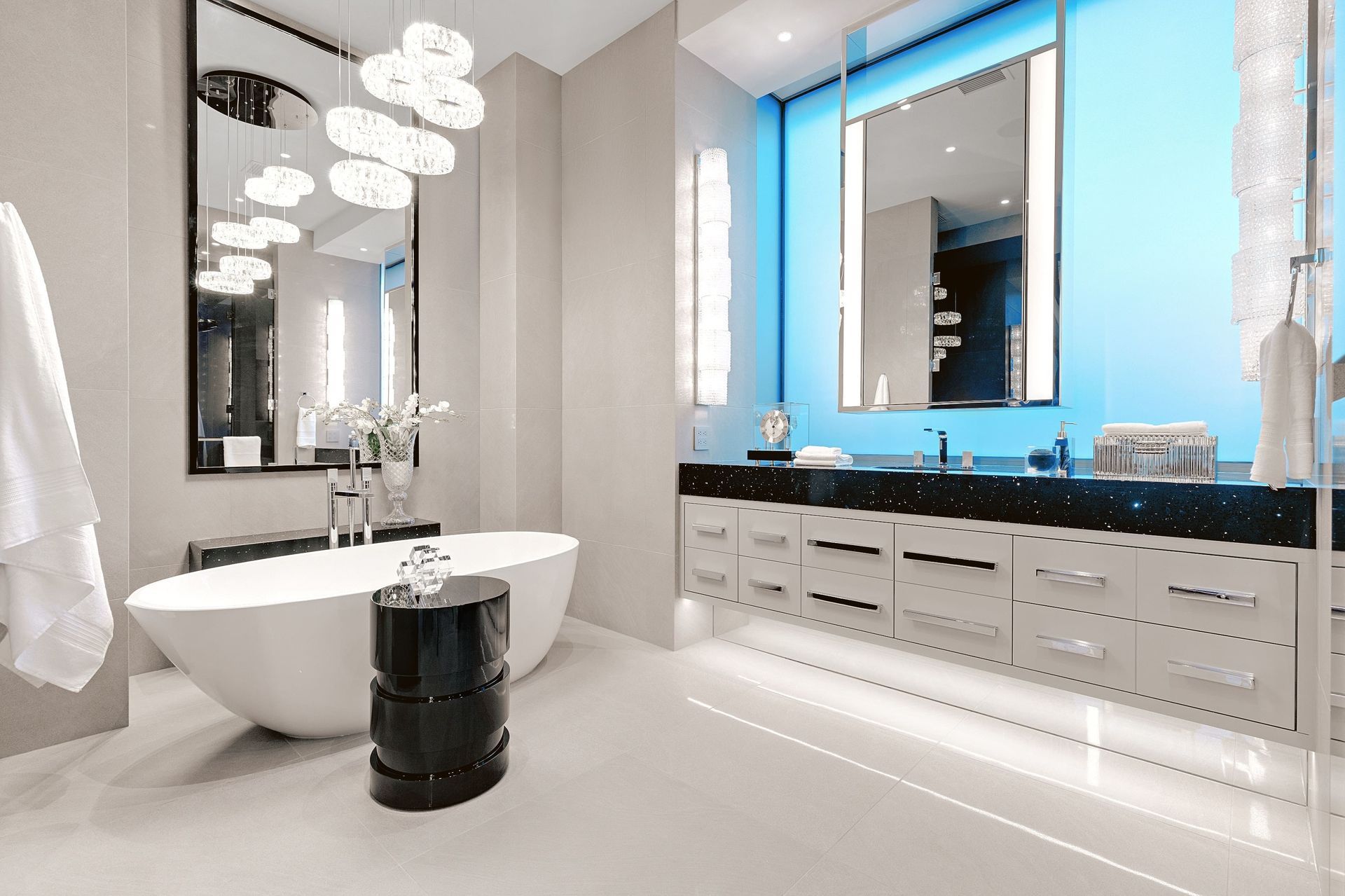 Modern bathroom with sleek fixtures, minimalist design, free standing modern tub, and abundant light.