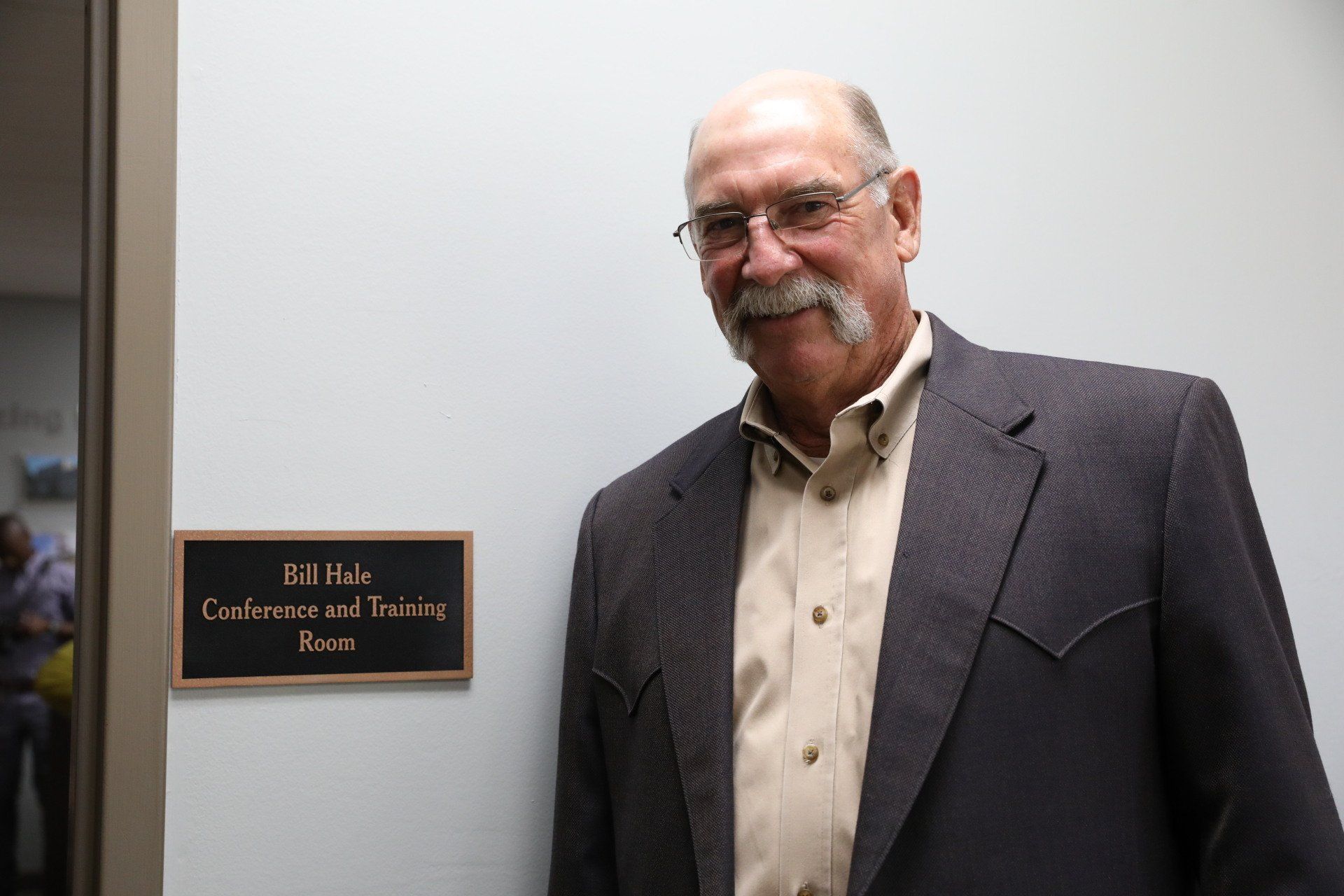 A man standing in front of a conference and training room