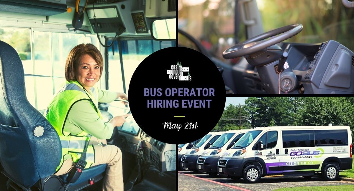 A woman is sitting in the driver 's seat of a bus.