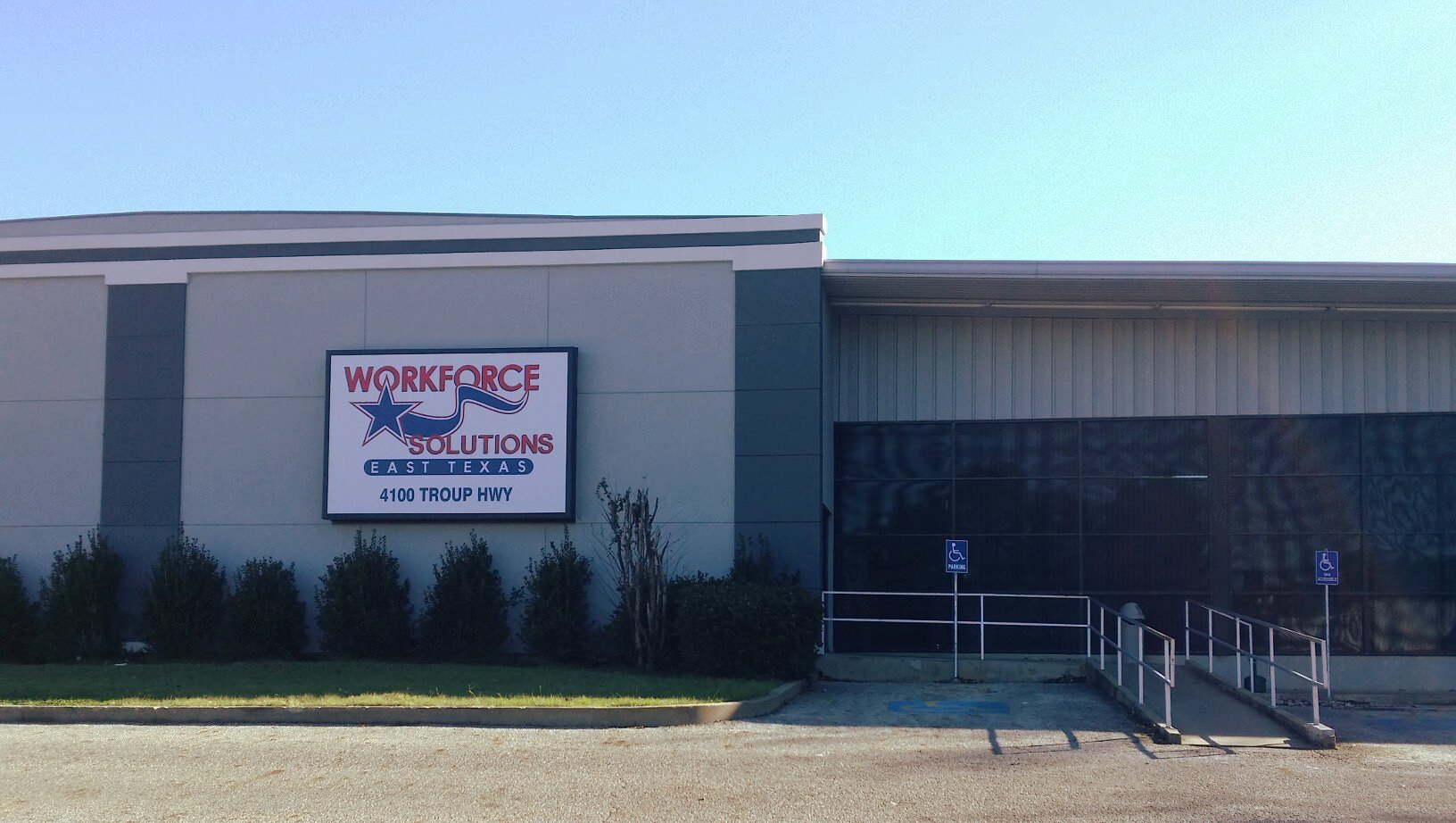 A large building with a sign that says workforce on it