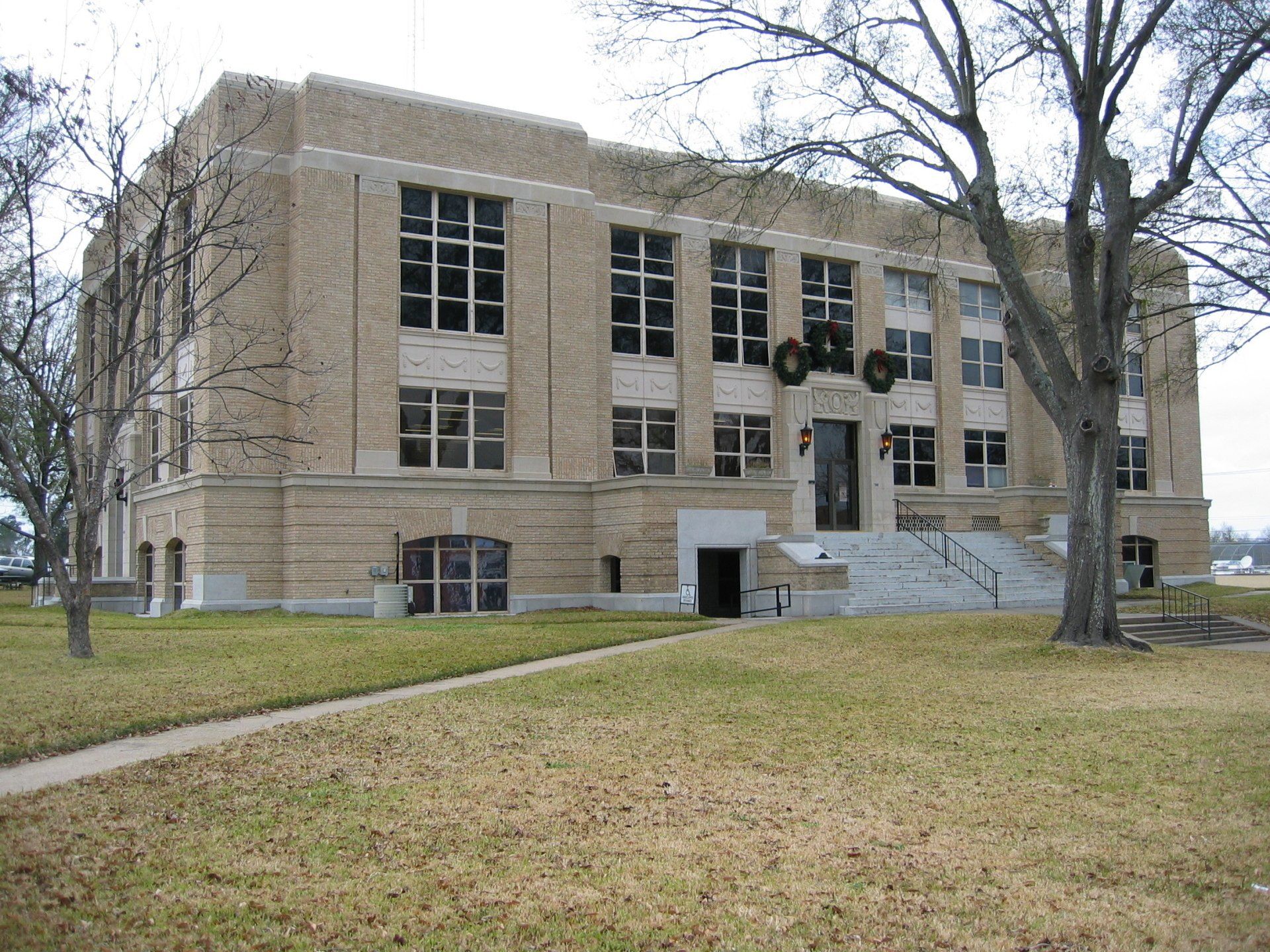 A large brick building with stairs leading up to it