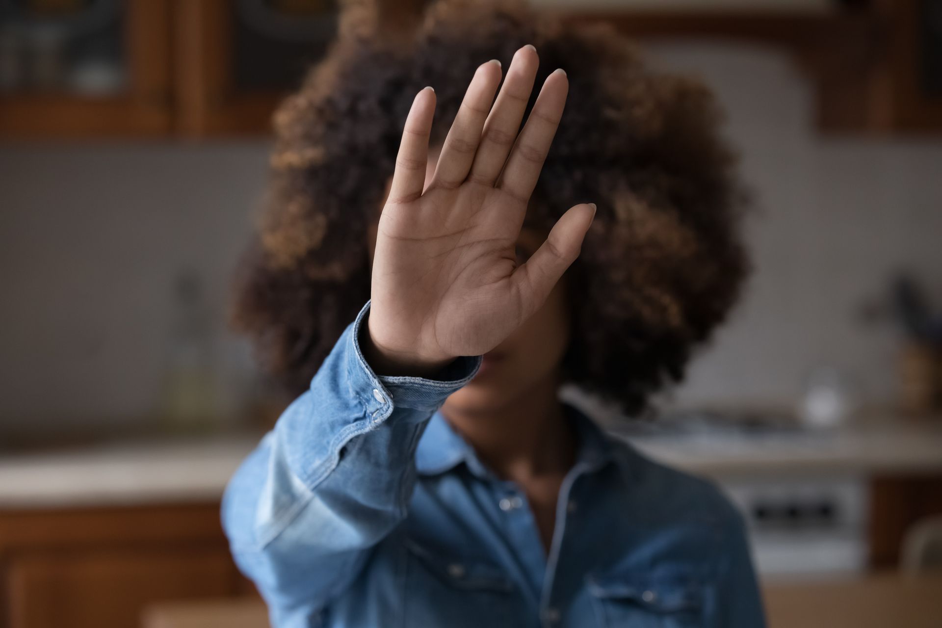 woman putting her hand out in front of her