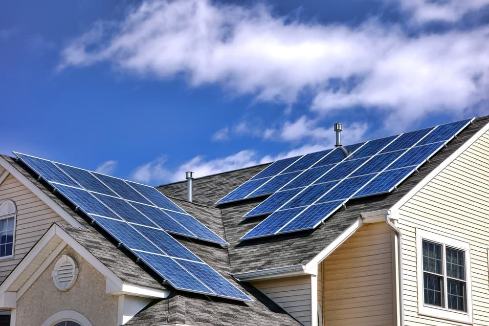 A House With a Lot of Solar Panels on the Roof — Eco Sparks Solar & Electrical Contractors in Darwin, NT