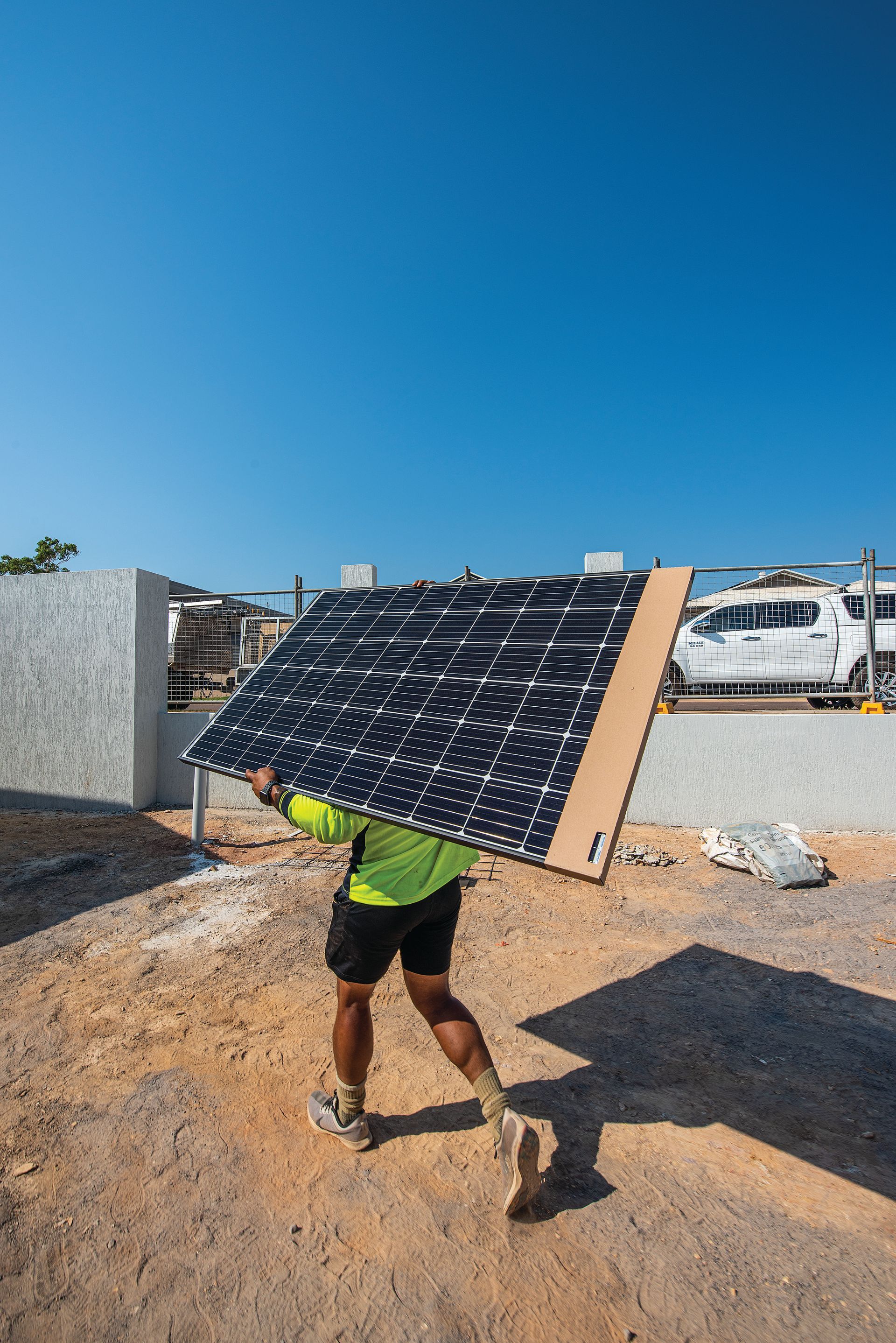 A Person Is Working on A Solar Panel with A Drill — Eco Sparks Solar & Electrical Contractors in Berrimah, NT