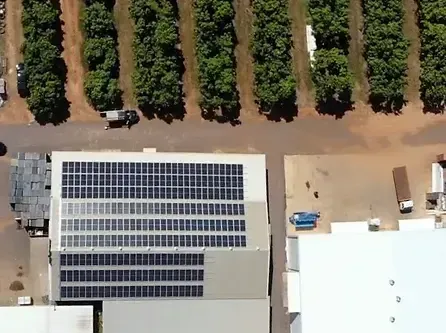 An Aerial View of A Building with Solar Panels on The Roof — Eco Sparks Solar & Electrical Contractors in Berrimah, NT