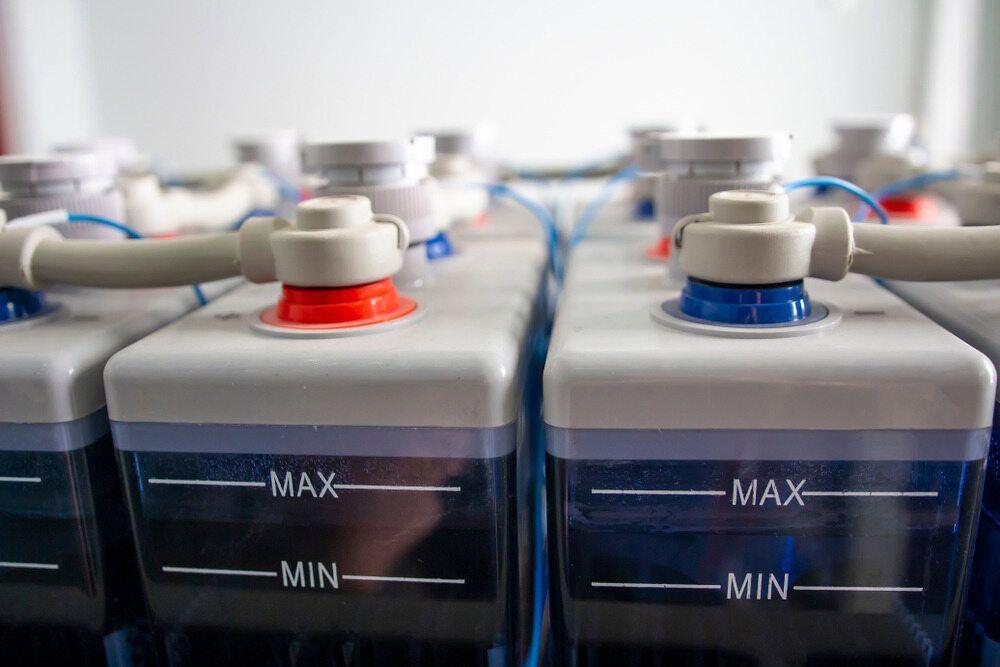 A Row of Batteries Are Sitting Next to Each Other in a Room — Eco Sparks Solar & Electrical Contractors in Berrimah, NT