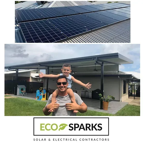 A Man Is Carrying a Child on His Shoulders in Front of A Solar Panel — Eco Sparks Solar & Electrical Contractors in Berrimah, NT