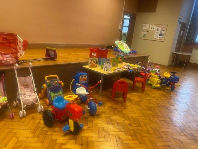 A room filled with lots of toys on a wooden floor