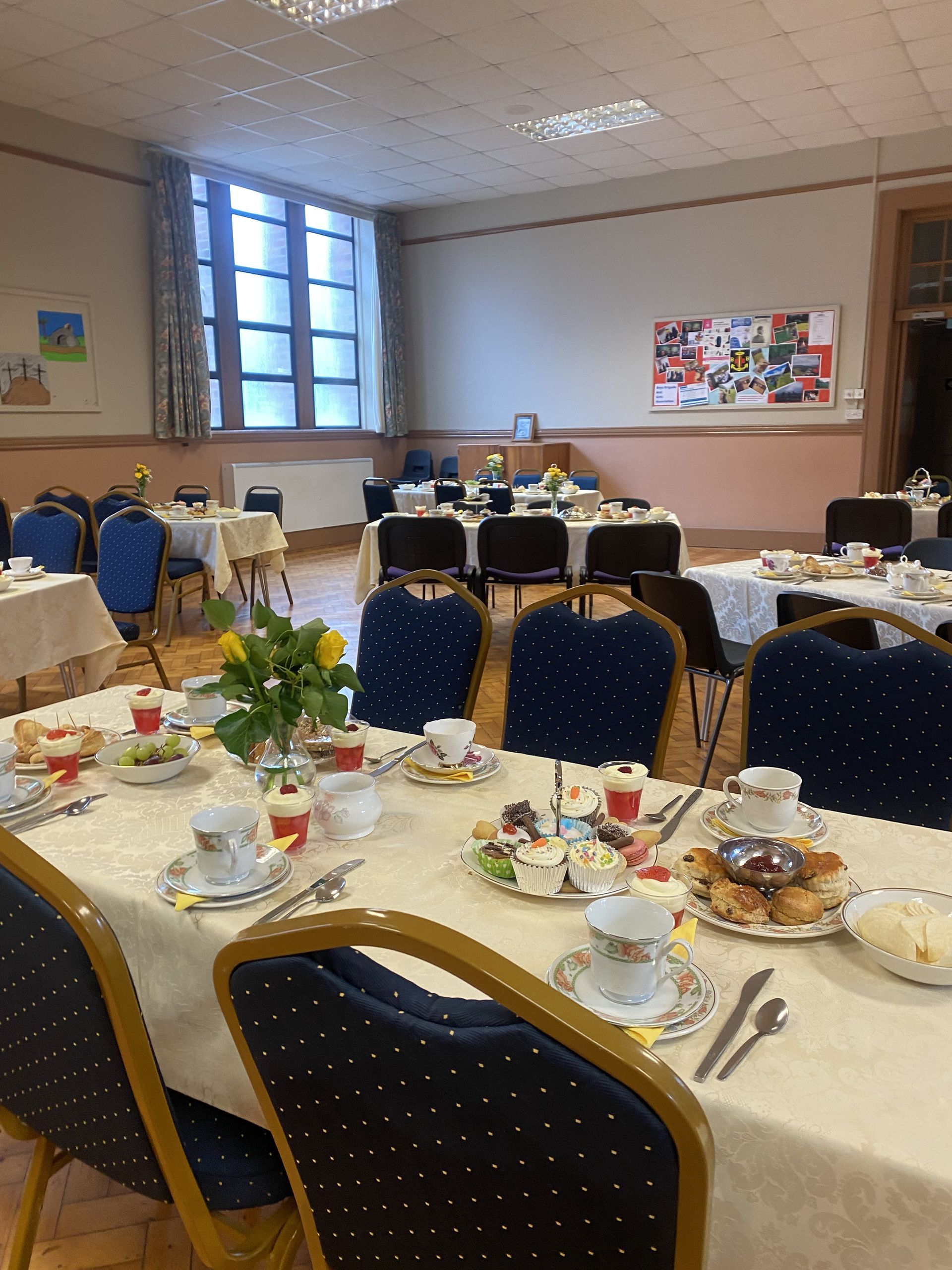 A room with tables and chairs set up for a party