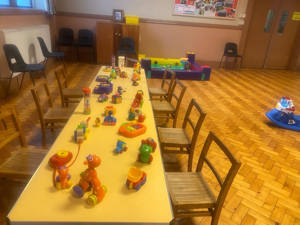 A long table with lots of toys on it