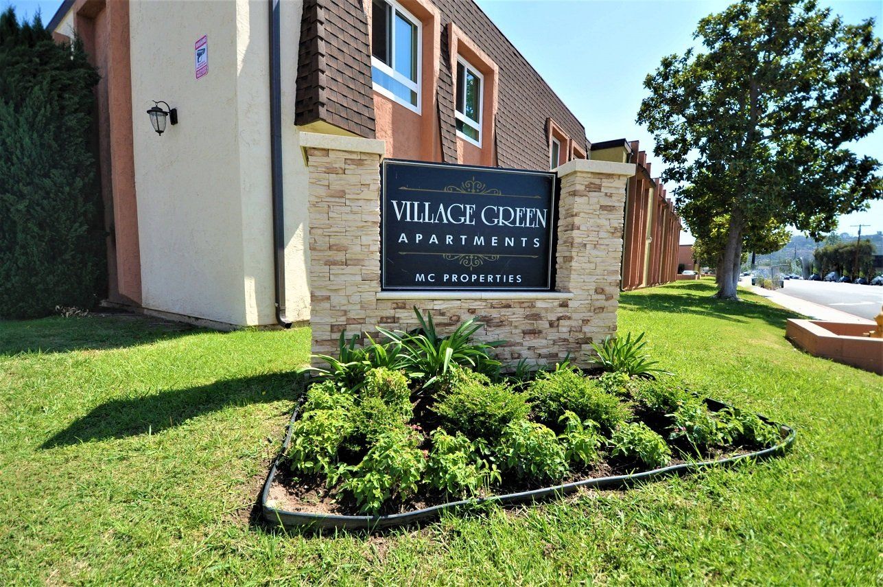 Village Green Apartments sign