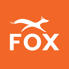 White fox leaping over