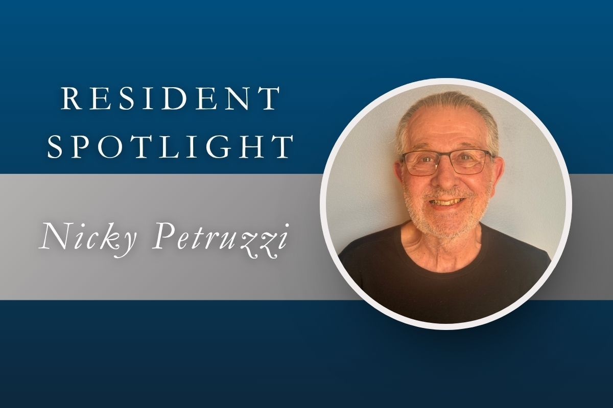 Resident Spotlight graphic with text and a smiling man’s portrait on a blue background